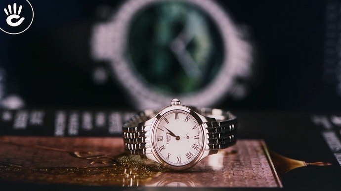 Tissot Bella Ora T103.110.11.033.00 - Nữ - Quartz (Pin) - Chống nước 3 ATM - Mặt số 27.2mm 5 Review Tissot T103.110.11.033.00, kính Sapphire chống trầy-1